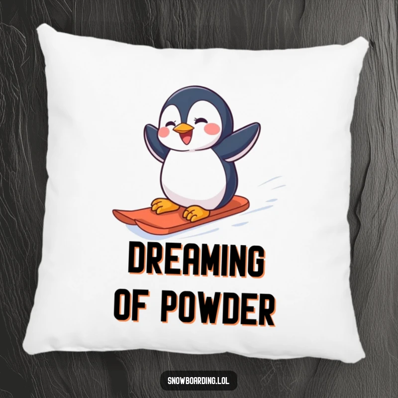 Funny joyful penguin carving down a snowy slope on a snowboard on a plush pillow.