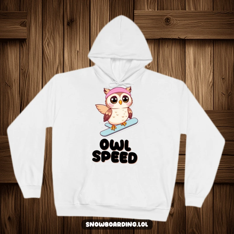 Funny hoodie with a beaming owl, eyes wide, snowboarding downhill, perfect for staying warm with humorous winter exhilaration.