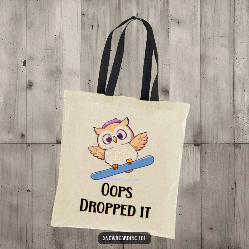 Funny tote bag with a startled owl tumbling off a snowboard, its eyes wide with comical surprise.